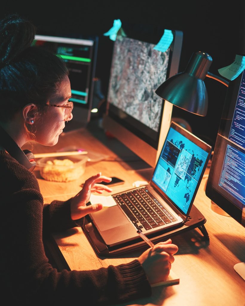 Cybersecurity, woman and computer with global info with map graphic for phishing and hacker data. C